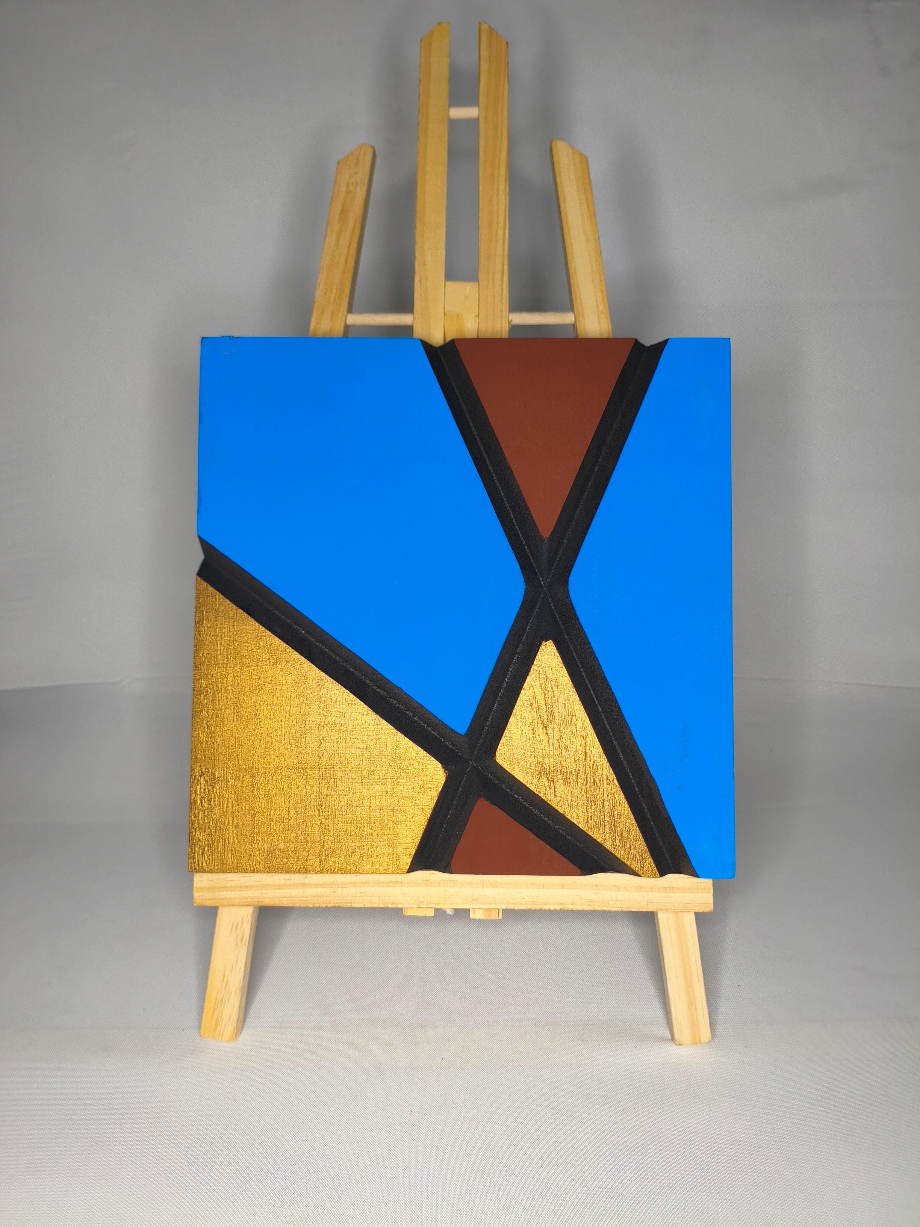 Quadro Astratto Blu, Oro e Marrone – La X – Legno di Paulonia